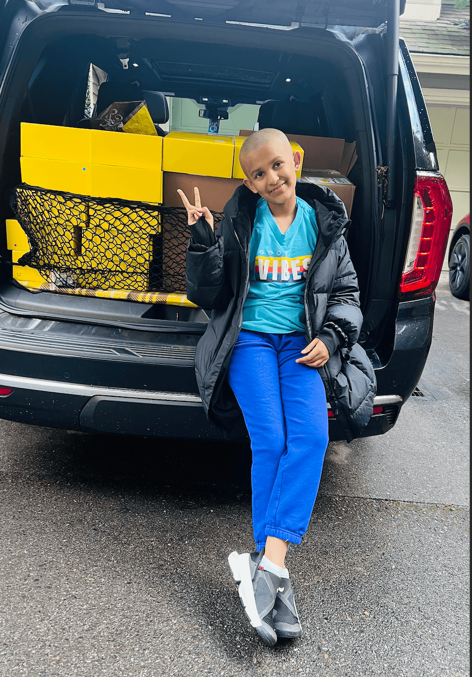 Volunteers delivering comfort kits to the hospital welcome desk.