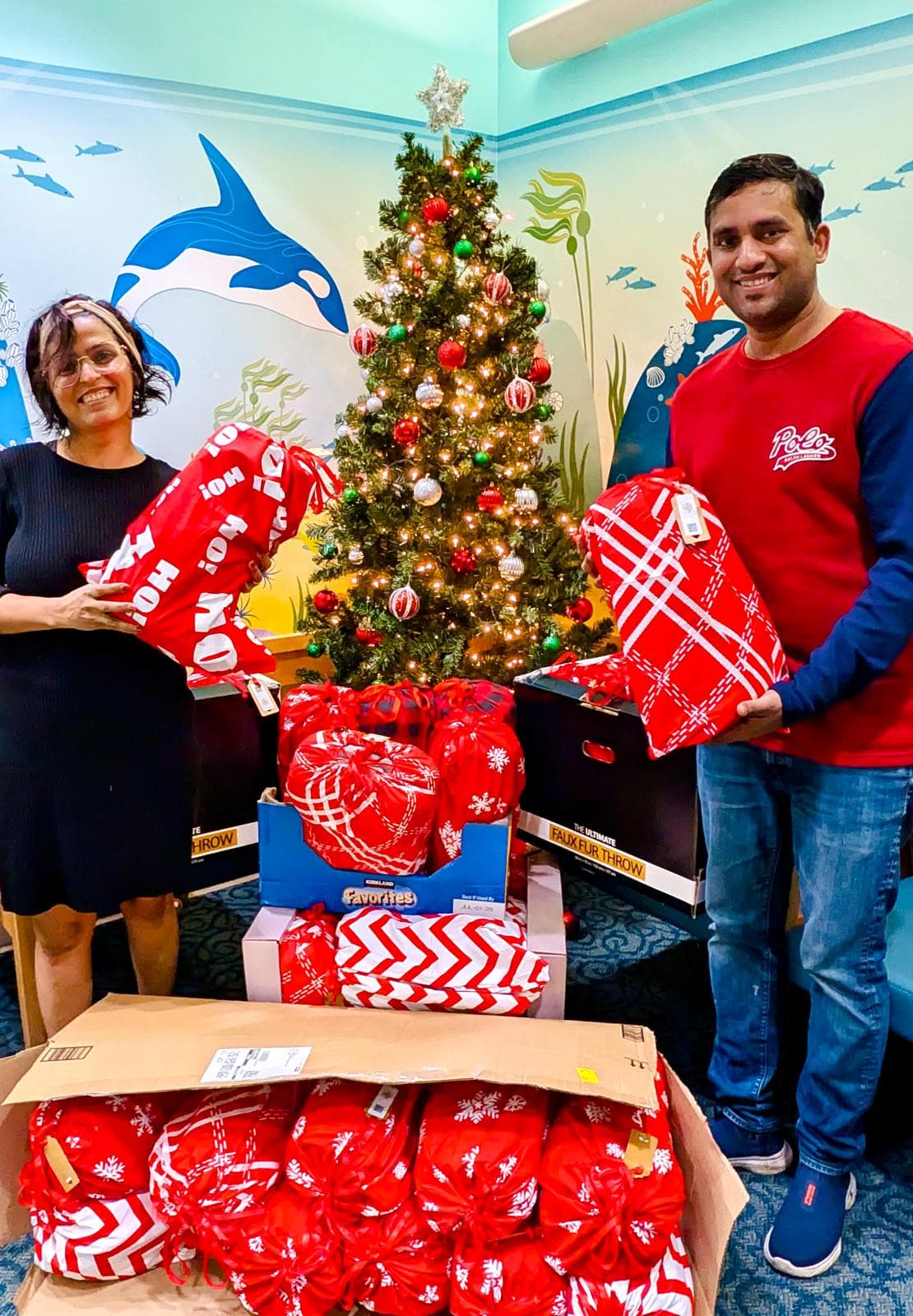 Volunteers packing festive bundles at Mary Bridge Children’s.