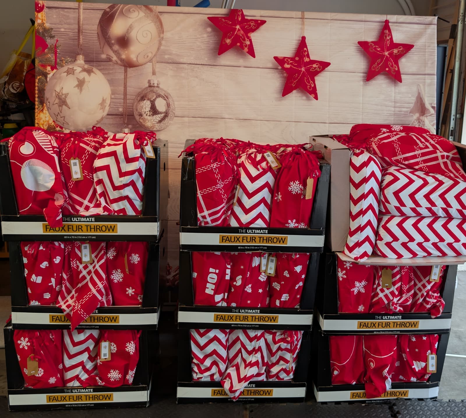 Volunteers staging stacks of cozy blankets to pack.