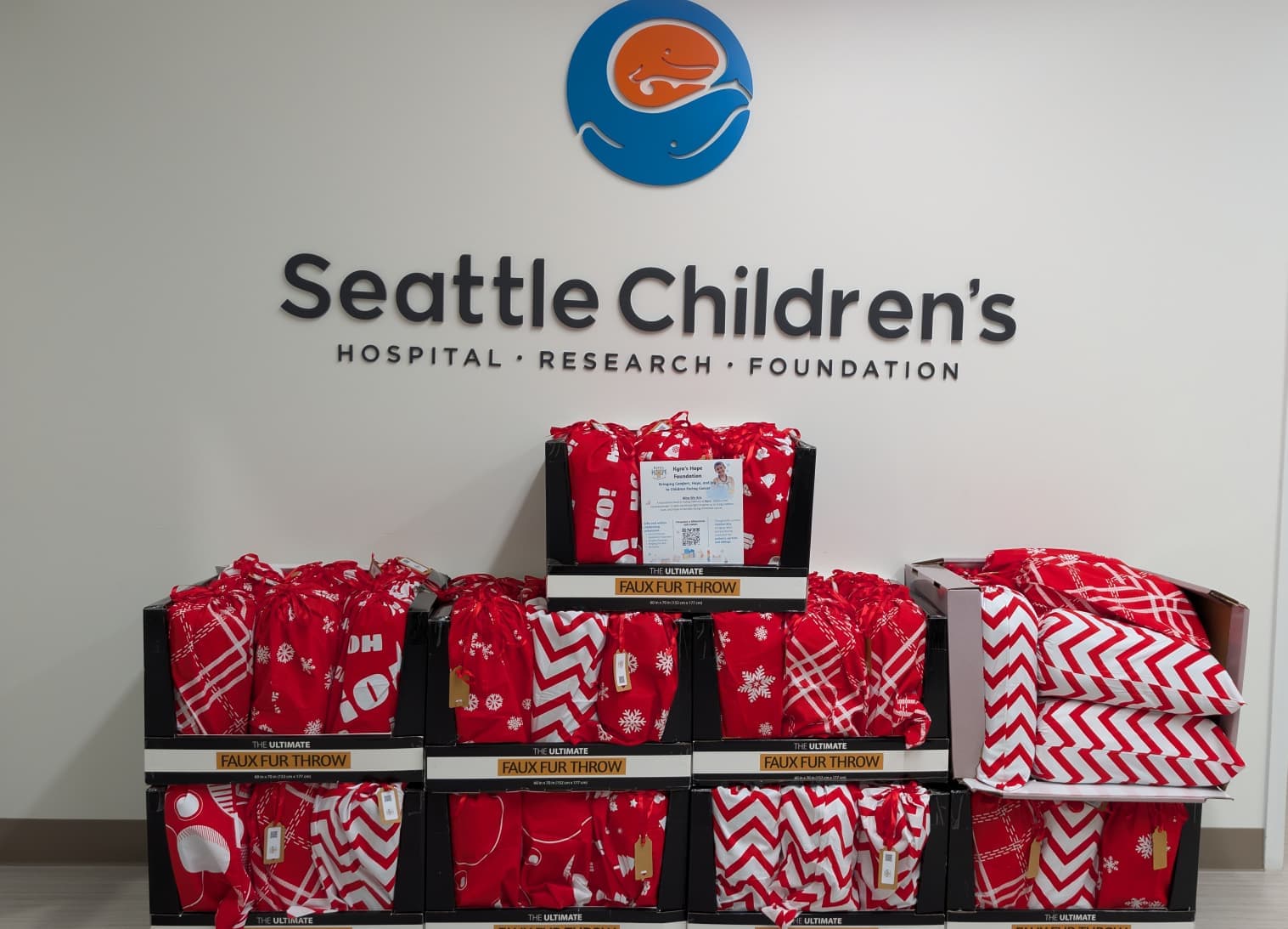 Kyra’s Hope volunteers assembling holiday gifts at Seattle Children’s Hospital.